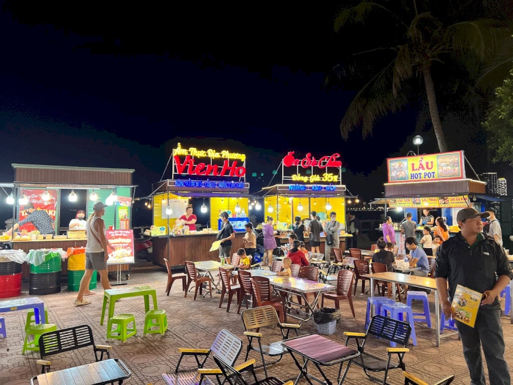 Eating at street-side stalls with tiny tables and chairs packed closely together is an incredibly unique experience